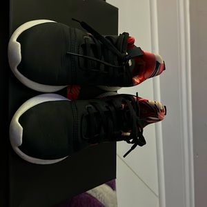 Black with burgundy stripes Adidas running shoes